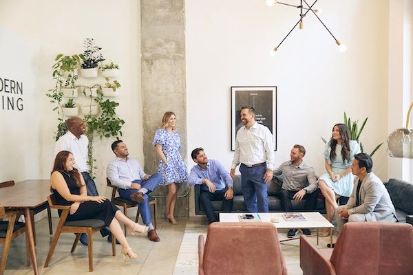 Modern Living Group agents collaborating in the West Palm Beach office